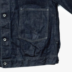 Close-up of the indigo fabric showing weave texture, depth of color, and durable vintage-inspired character.