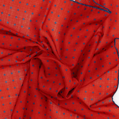 Close-up detail of the Adamley Bandana Small Poka Orange
