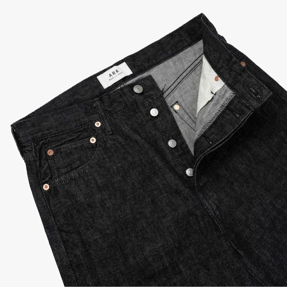 Close-up of the waistband and top button on the Ark Sydney Black Jeans showing stitching, hardware, and clean finishing.