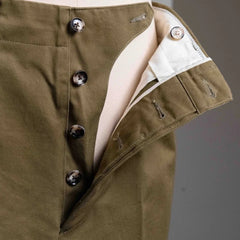 Close-up of the zip area and top button on the Barnstormer Officer Chino Olive showing the fly construction, stitching, and metal hardware.