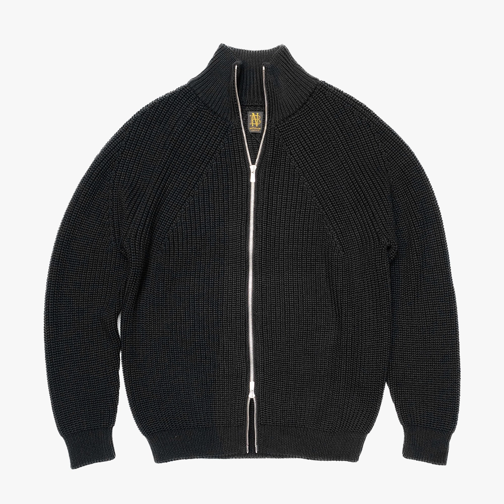 Front view of the Batoner Signature Drivers Knit Jacket in Black, showing its dense structured knit, clean silhouette, and two-way zipper.