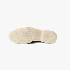 Close-up of the flexible leather sole showing clean edge finishing and comfort-focused construction.