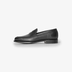 Berwick 5138 Penny Loafer in Chateaubriand black leather, side profile showing sleek silhouette.