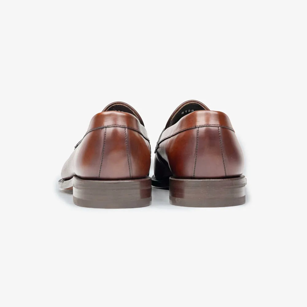 Berwick 5138 Penny Loafer in medium brown leather, back view highlighting heel stitching.