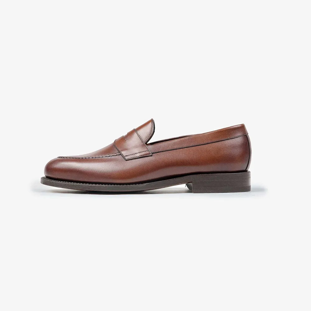Berwick 5138 Penny Loafer in medium brown leather, side profile showing clean silhouette.