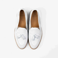Berwick 5139 Tassel Loafer in white grained leather, top view of pair highlighting tassels.