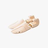 Full view of the Berwick shoe tree in natural wood showing the classic split-toe design and smooth finish.