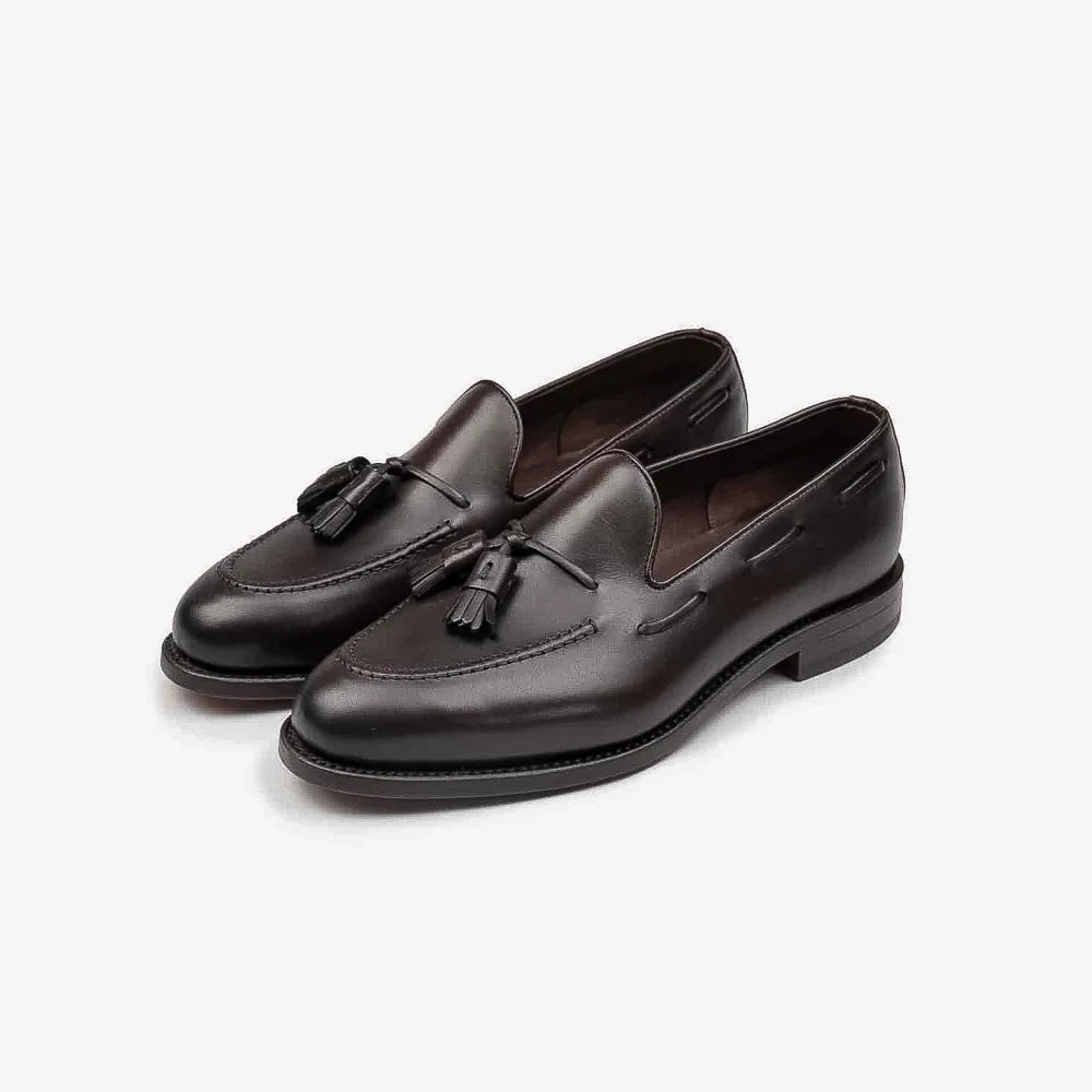 Berwick 5139 Tassel Loafer in Nomera dark brown leather, angled front view showing tassel detail.