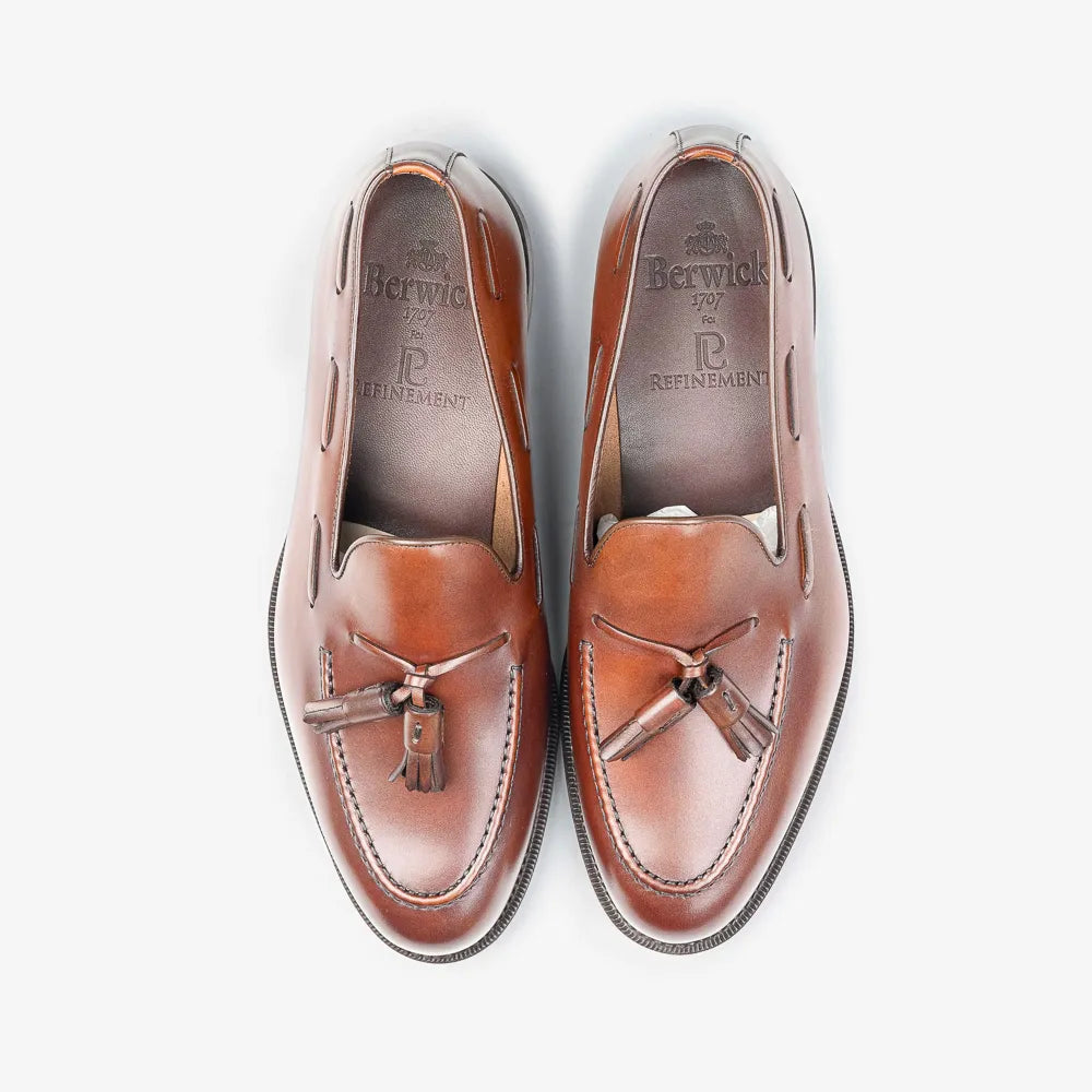 Berwick 5139 Tassel Loafer in Nomera medium brown leather, top view of pair with tassels visible.
