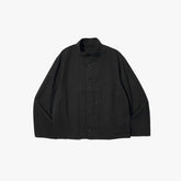 Front view of the Brú Na Bóinne Sapiens cloth jacket in black featuring a clean silhouette and lightweight construction.