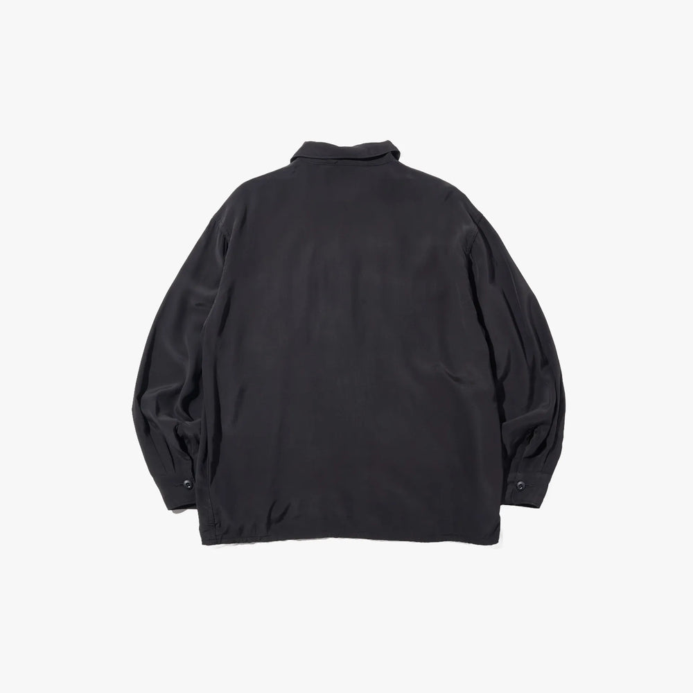 Back view of the Brú Na Bóinne silk military shirt in black showing the relaxed structure and minimal detailing.