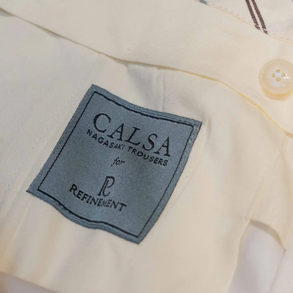 Brand label detail of the Calsa Nagasaki Trousers Cotton Beige