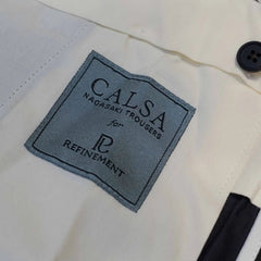 Brand label detail of the Calsa Nagasaki Trousers Covert Dark Green