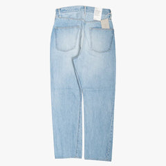 Back view of the Ciota denim in light blue damage showing classic five-pocket construction and faded detailing.