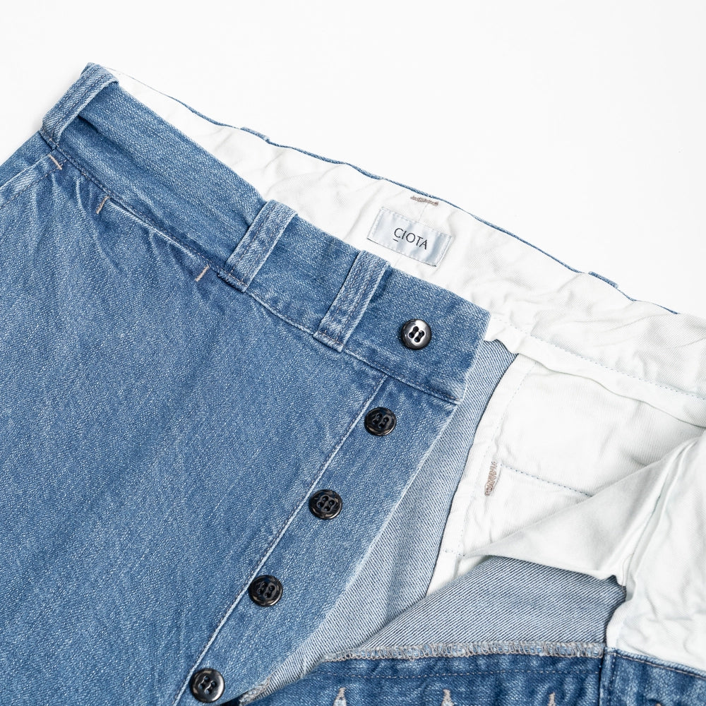 Close-up of the fly showing zipper and button construction with reinforced stitching.