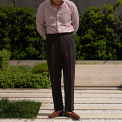 Full body front view of a model wearing the Drummers Trousers Brown showing the straight-leg fit, drape, and natural stance.
