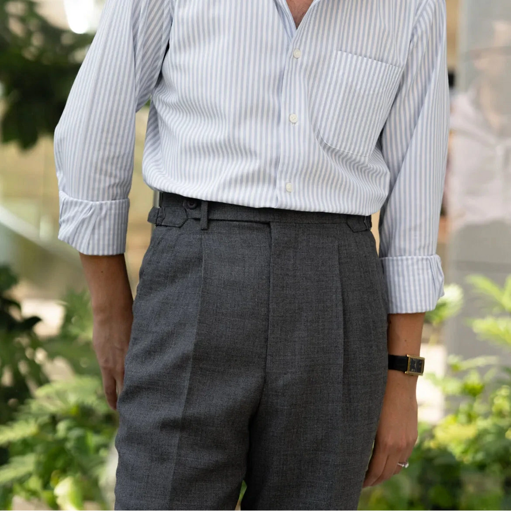 Full body front view of a model wearing the Drummers Trousers Mid Grey showing the straight leg fit, natural stance, and clean drape.