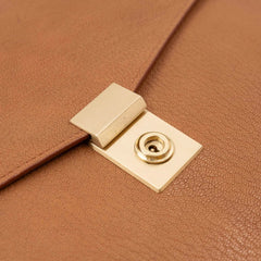 Lock detail of the Frank Clegg 15-inch Lock Portfolio Case Goatskin Camel