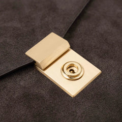 Lock detail of the Frank Clegg 15-inch Lock Portfolio Case Suede Chocolate