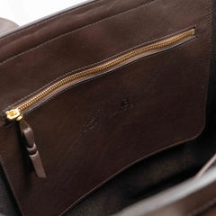 Interior zip pocket of the Frank Clegg for Refinement Tumbled Chocolate Tote Bag
