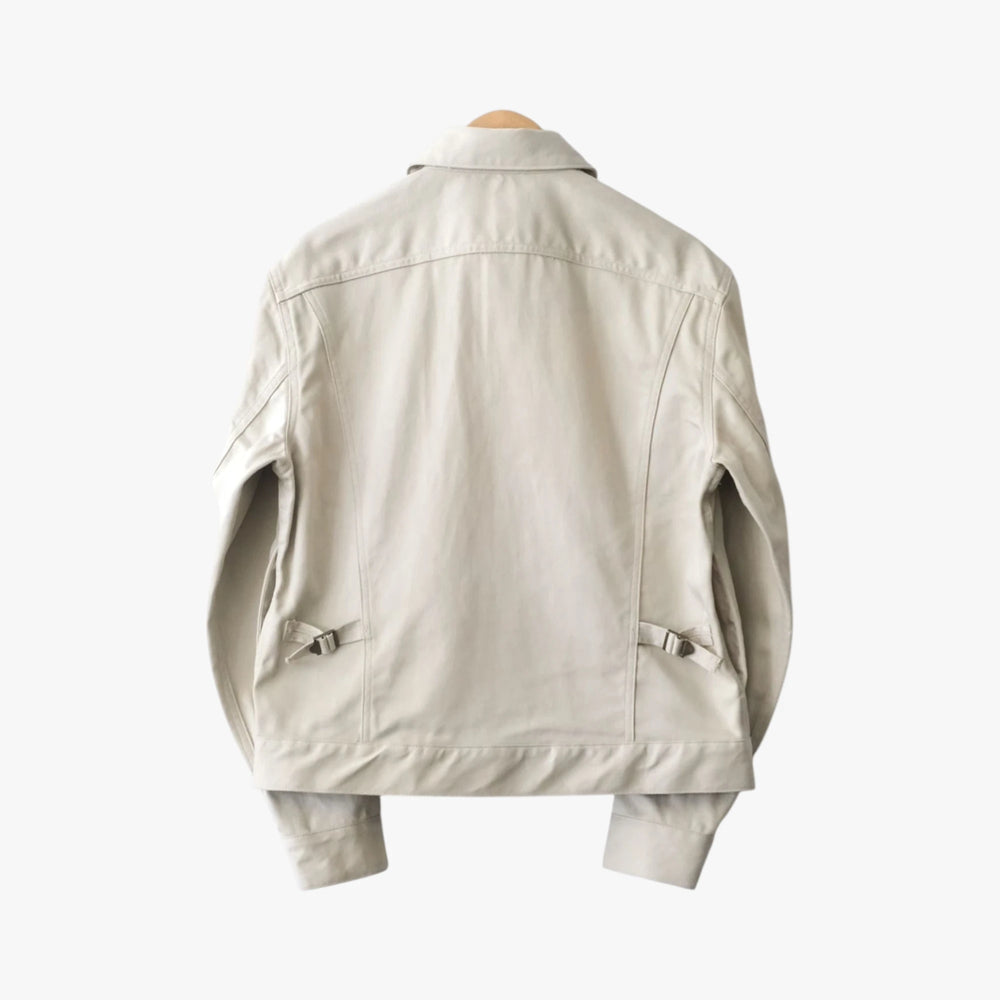 Back view of the Fujito cowboy jacket in light beige showing the structured shape and minimal detailing.
