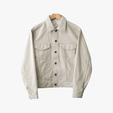 Front view of the Fujito cowboy jacket in light beige featuring a clean silhouette and western-inspired design.