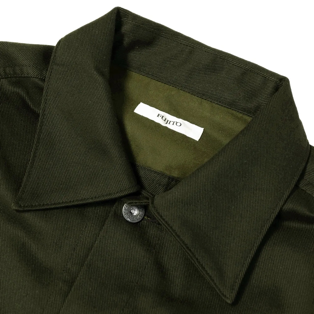 Close-up of the collar and front placket highlighting button closure and fabric texture.