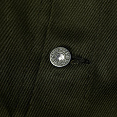 Close-up of the sleeve cuff showing button fastening and clean finishing.
