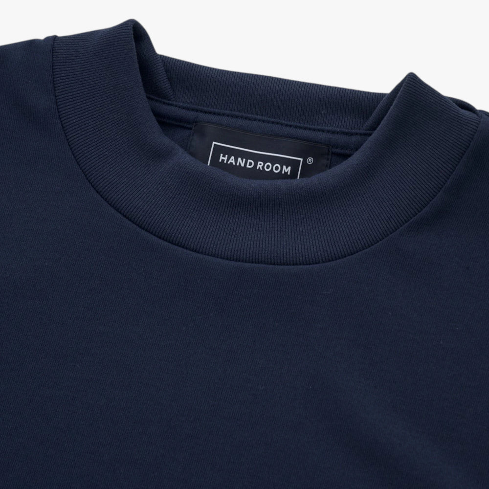 Close-up of the fabric showing soft cotton texture and refined stitching.