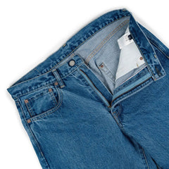 Close-up of the waistband button on the Hand Room Exclusive for Refinement Wide Fit Light Washed jeans