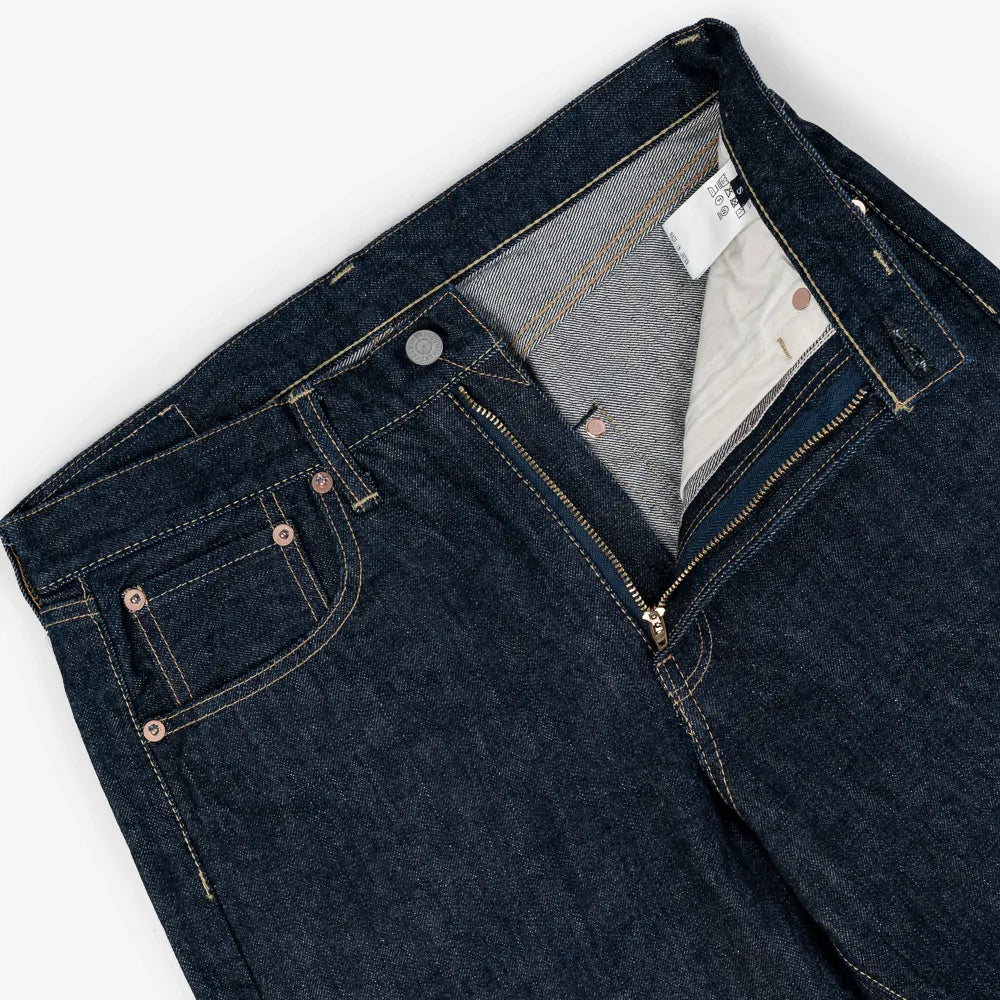 Close-up of the waistband button on the Hand Room Exclusive for Refinement Wide Fit One Washed Indigo jeans