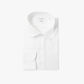 Front view of the Hitoyoshi Spread Collar Shirt in White showing the clean silhouette, refined spread collar, and crisp cotton texture.