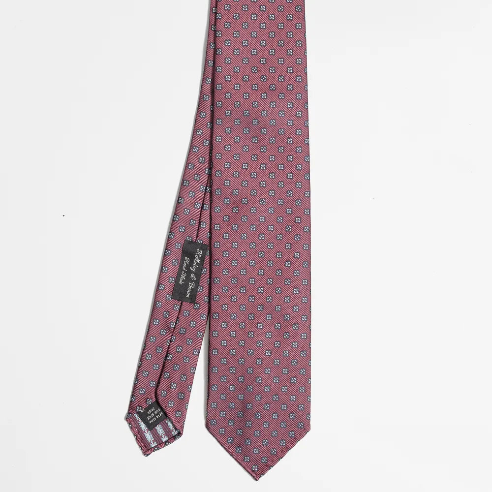 Full view of the Holliday & Brown floral tie in beetroot showing elegant floral pattern and refined proportions.