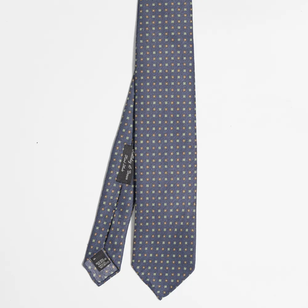 Full view of the Holliday & Brown floral tie in navy and brown showing elegant floral pattern and refined proportions.