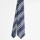Full view of the Holliday & Brown jacquard tie in navy and ivory showing refined woven pattern and elegant proportions.