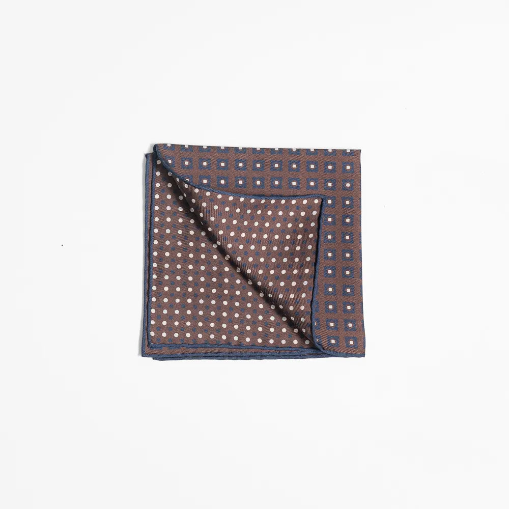Folded view of the Holliday & Brown pocket square showing pattern placement and finishing detail.