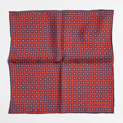 Full view of the Holliday & Brown dot pocket square in red showing classic polka dot pattern and refined proportions.