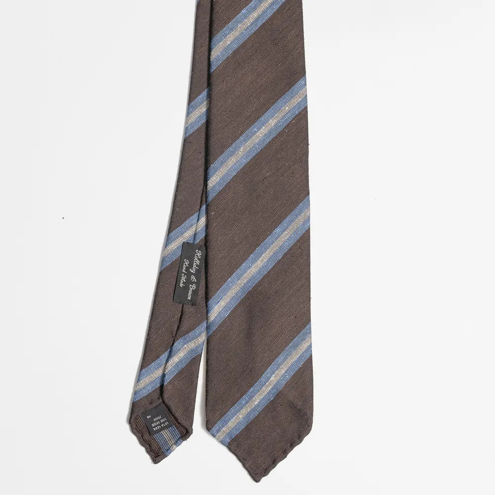 Full view of the Holliday & Brown stripe tie in brown and blue showing classic diagonal stripe pattern and refined proportions.