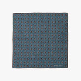 Full view of the Holliday & Brown pocket square in blue paisley, showing the full pattern layout, border design, and rich blue tones.