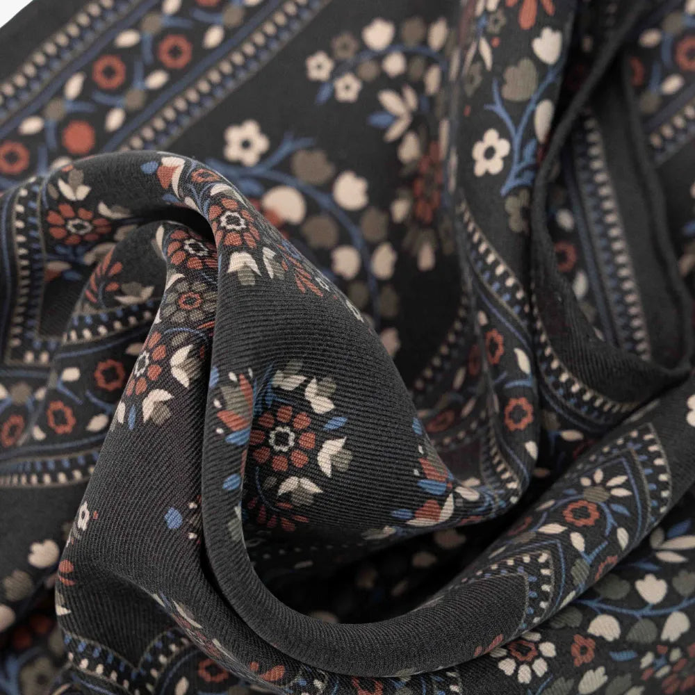 Close-up of the Holliday & Brown pocket square in grey highlighting the soft drape, fine weave, and detailed print work.