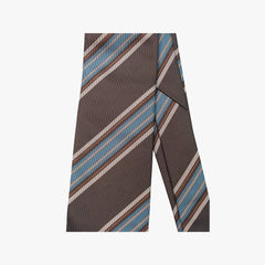 Close-up of the tie blade highlighting the brown and blue stripe pattern, diagonal weave, and refined color balance.