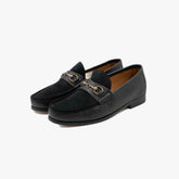 Il Mocassino B-Reverso 17 Peg/Kaieido Nero loafer, angled front view showing sleek black leather.