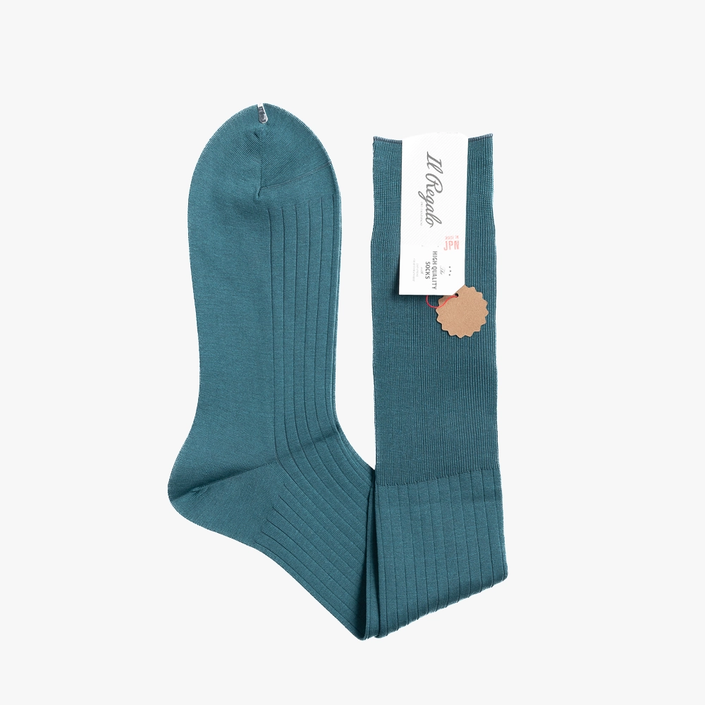 Folded view of the Il Regalo 8x2 Rib Over-The-Calf Socks in Green highlighting the rib knit texture and reinforced toe.
