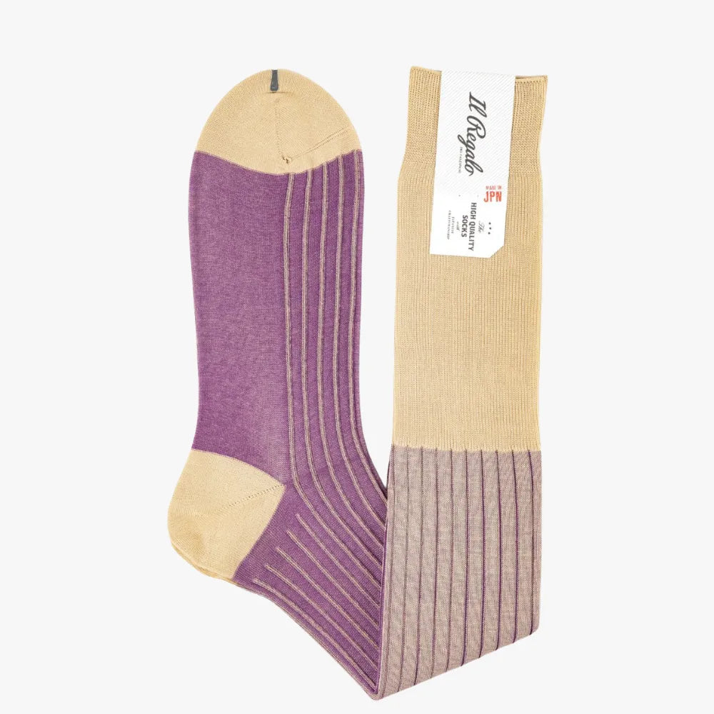 Side view of the Il Regalo Reversible Over The Calf Socks showing the rib knit pattern, contrasting heel and toe, and reversible two-color design.