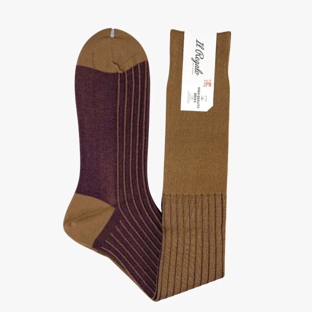 Side view of the Il Regalo Reversible Over The Calf Socks highlighting the rib-knit structure, contrasting heel and toe, and two-color reversible design.