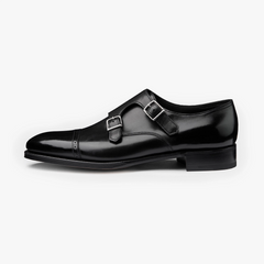 Side view of the John Lobb Philip II in Black highlighting the sleek silhouette, polished buckles, and clean leather finish.