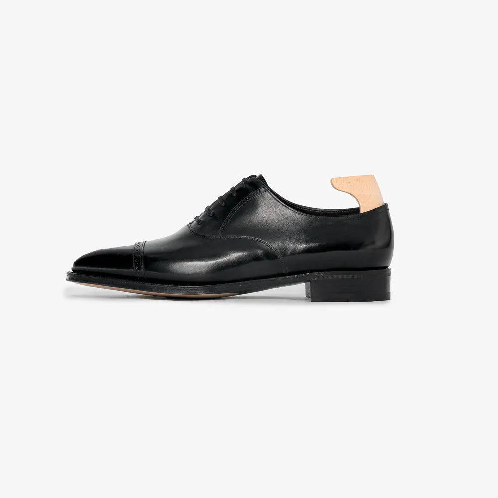 John Lobb Philip II Oxford in black calf leather, side profile highlighting elegant silhouette.