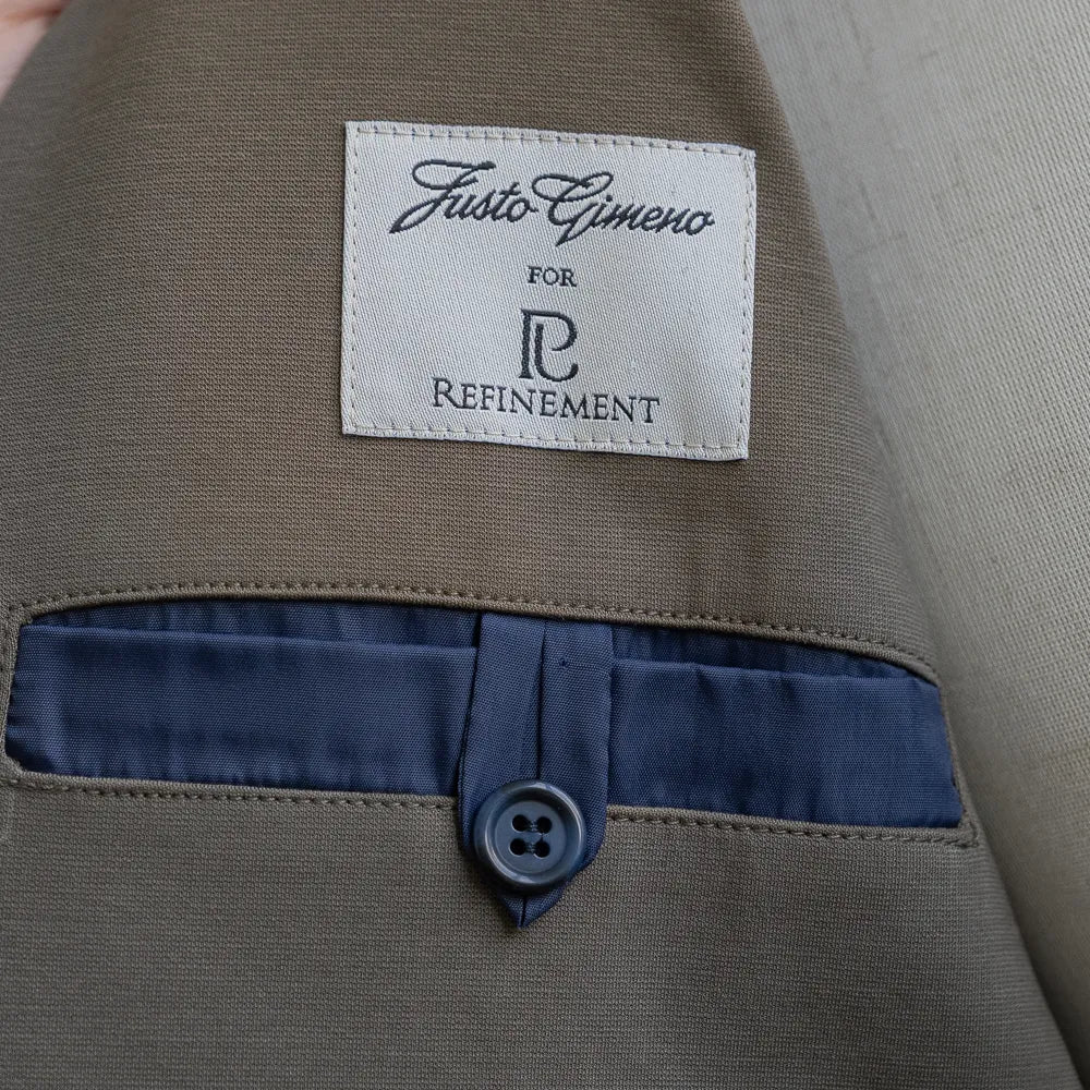 Inner brand label of the Justo Gimeno Teba Jacket Hopsack by VBC Green