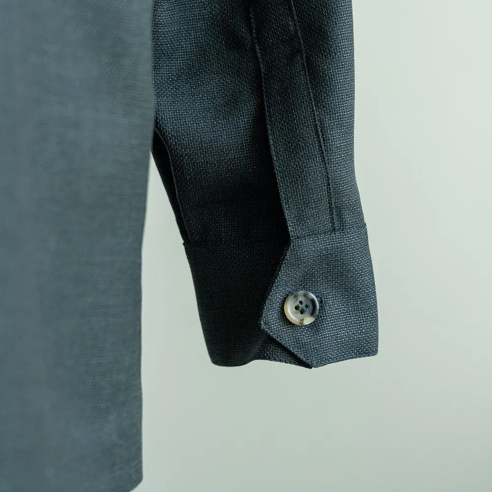 Sleeve and button detail of the Justo Gimeno Teba Jacket Hopsack by VBC Green