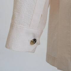 Sleeve and button detail of the Justo Gimeno Teba Jacket Seersucker Cream